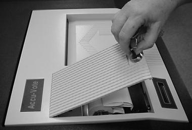23. FOLD or roll the tape and leave it in the printer compartment. 24. REPLACE and lock the printer cover and remove the red-rimmed key.