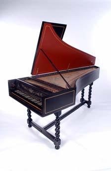 The harpsichord The harpsichord is a keyboard instrument with thin metal strings plucked by small pieces of quill.