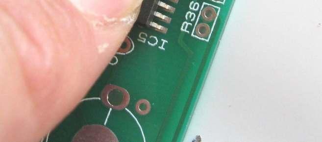 Use a fine-tipped soldering iron and fine flux-cored solder.
