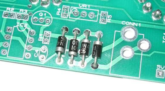 When all sockets have been placed, place a flat and hard object over the top of the sockets, and turn the PCB over so you can solder from the underside.