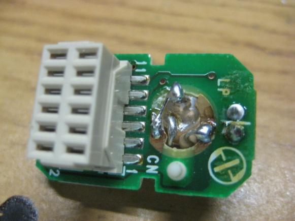(Behind the connector, does not show in the picture.) 0V + 12V Then you solder in 2 cables where the Lamp socket is.