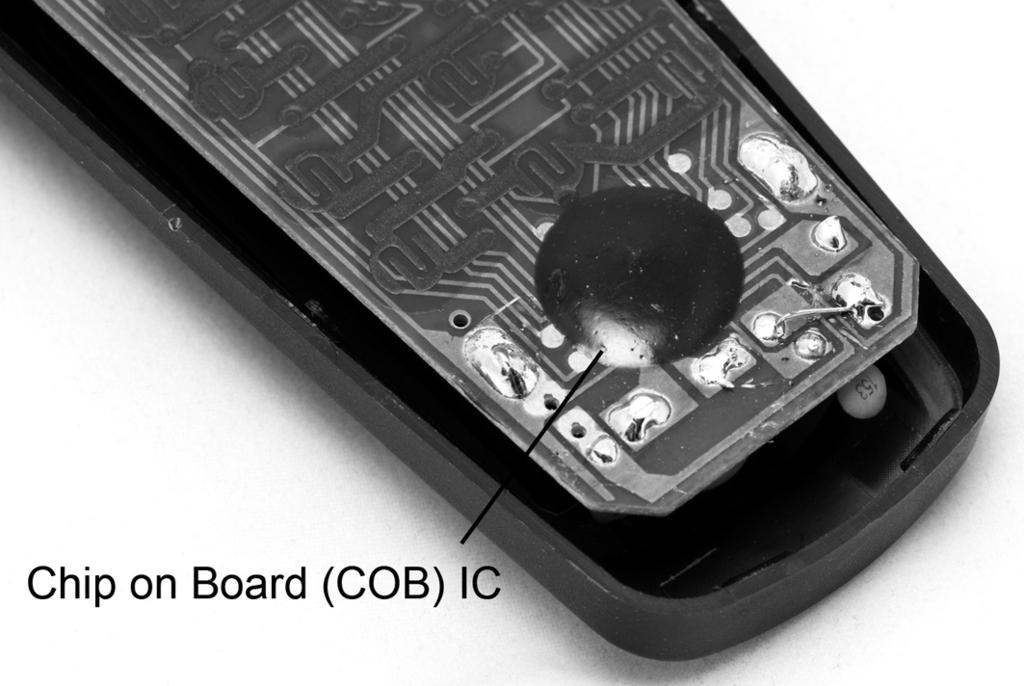 (b) The Chip on Board (COB) IC shown in Fig. 4 is encased in epoxy resin. 5 Fig.