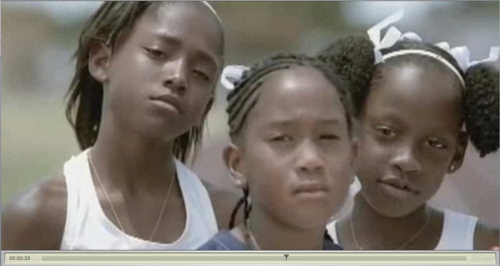 Scene 11 Medium shot. Three young African- American girls look directly into the camera music, nondiegetic voiceover.