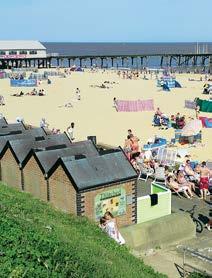 With wide golden sands, beach huts and two piers, it s perfect for swimming and paddling, building