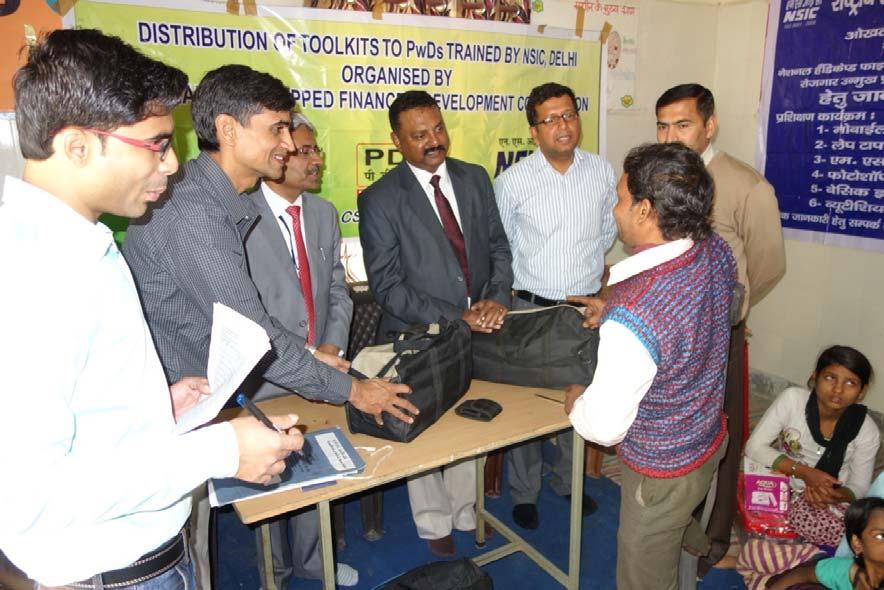 Sri SK Gupta, GGM (BS&I) and Sri SK Sinha Addl. GM (CSR) distributing tool kits to beneficiaries.