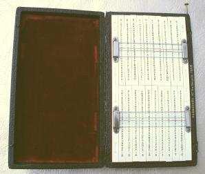 The device consists of a metal frame with ten lanes, each of which holds two movable rods with scrambled alphabets.