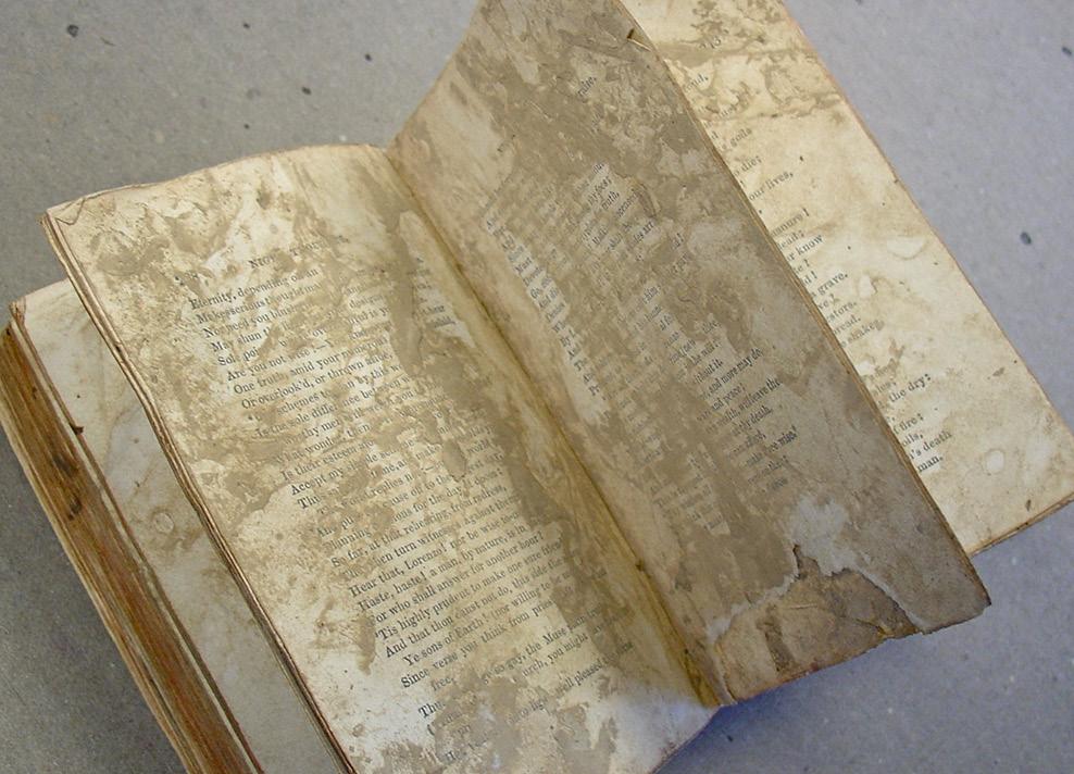There is considerable staining to the last leaf of text demonstrating that it has been in contact with the covering leather for quite some time.