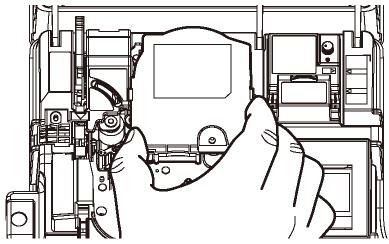 3. LOADING THE CONSUMABLES 6. Hold the ink ribbon case as illustrated below and load it. Proper loading Note: Make sure the ribbon is not slack. 7. Pull the head release lever forward. 8.