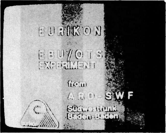 i'i'.111:4.-- Left: Eurikon DBS test identification logo, unscrambled. Centre: The same signal but this time scrambled. Photos from A. Wiese.