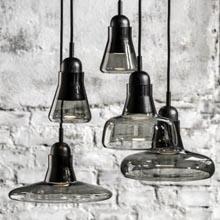 THE COLLECTION COMPRISES FOUR DIFFERENT SUSPENSION LIGHTS, AS STRIKING ALONE AS THEY ARE IN SETS, CHARACTERIZED BY A