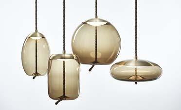 THE DESIGN COMBINES COARSE NATURAL FIBRE WITH SMOOTH, TRANSPARENT BLOWN GLASS TO AROUSE A CONTRAST AS