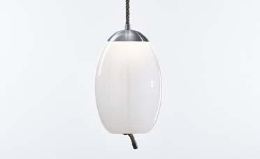 THE LED LIGHT SOURCE IS HOUSED IN A HANDSOME TOP HOOD, WHICH, LIKE THE CORD END CAP, IS FASHIONED IN