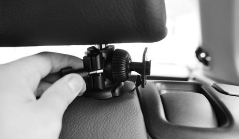 Place the mount and clamp around the headrest pole that best suits the camera placement that is needed.