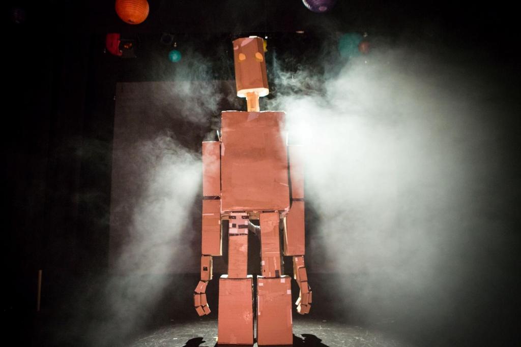 When the show begins there will be no lights on stage but the lights over your seats will stay on. You will see The Iron Man on stage and you will hear a voice telling you the words from the book.