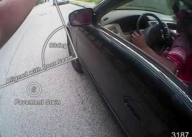 pole. In reviewing the body camera footage, the front driver s side wheel of the Honda Accord is adjacent to a distinctive oval shaped