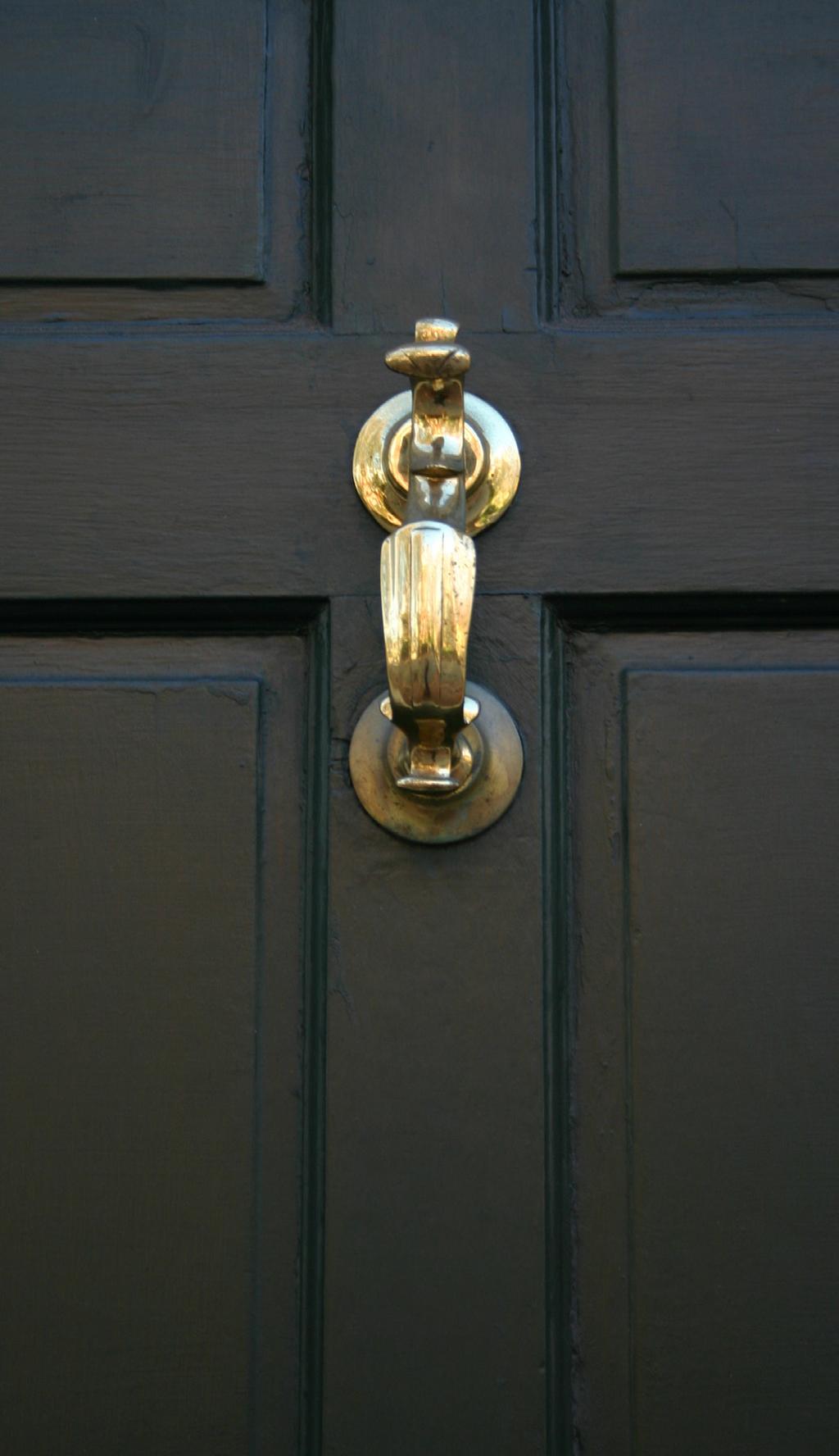 There was no door bell at 98 Benefit Street. Just a brass door knocker. I followed my procedure of documentation: I stepped back, framed the knocker in my camera, and took a photograph.