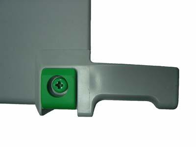In order to release the outer enclosure from the chassis, remove the larger screw (green