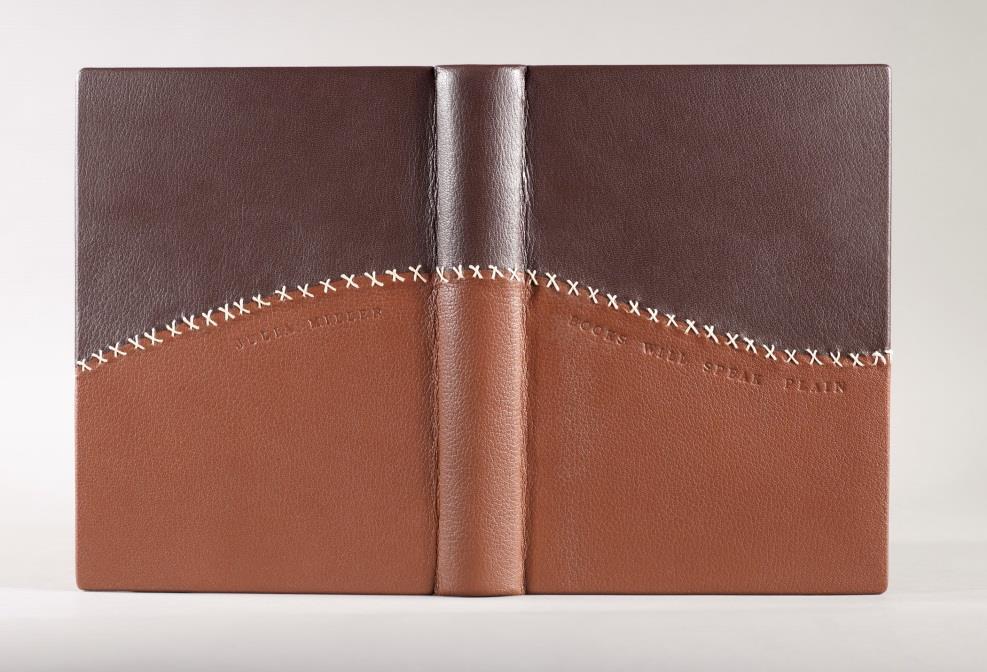 Whitney Baker Full leather binding using two contrasting colors of leather sewn together to mimic a former repair, top edge colored to highlight knife marks, front and back cover blind-tooled, sewn