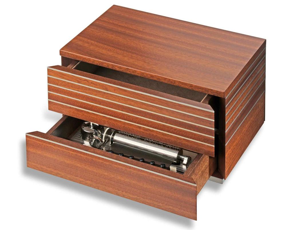 MONOLITH AXA.72.5645.000 BOX Mahogany, satin finish. Stainless steel horizontal lines inlaid. One upper drawer with brown velvet, to store souvenirs. One lower drawer that stores the musical movement.
