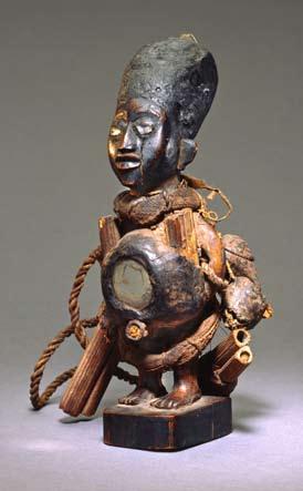 Fig 4 (left) Power figure (nkisi nkondi) Yombe peoples, Democratic Republic of the Congo 8th 9th century Wood, mirror, glass, cane, fiber, seed pod, jawbone H: 255 cm Fowler Museum at UCLA Gift of