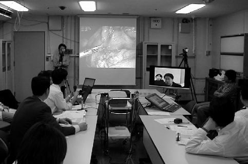 The monitor shows the audience in Korean side in moving-images, contents for presentation in still-images, and translated sentences by an auto translation system. Fig 5.