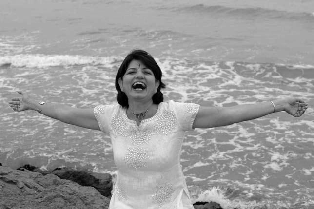 Madhuri Kataria doing Hearty Laughter on a beach in South France As discussed in earlier chapters, I am referring to the theory of motion creates emotions and emotions create motion i.e. if you act like a happy person over a period of time, you become one.