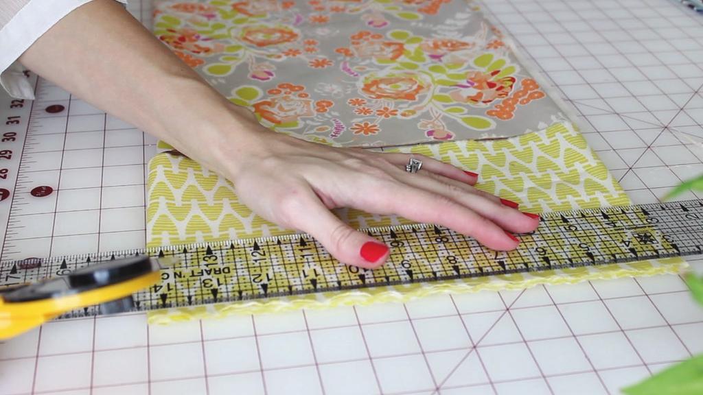CUT THE COVER FABRIC Cut two pieces of fabric that measure 2 taller than and 2 wider than the