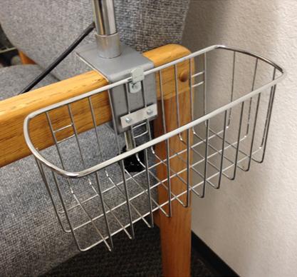 basket is attached to the clamp and located at the side of a chair, bed or a desktop.
