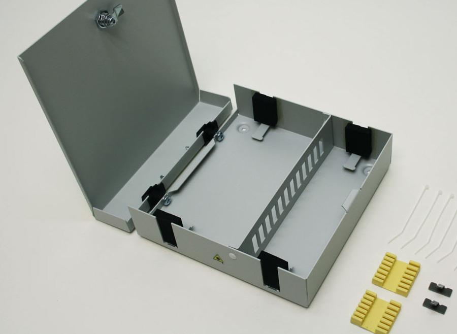 Size: 100 x 100 x 40 mm Material: Grey powder-painted aluminium Termination box NC-115 NC-115 is an universal type of wall box for terminating different type of optical cables with up to 24 fibres.