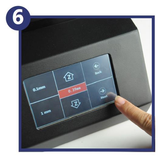 Remove the paper, then touch the Next button to start the automatic leveling process.