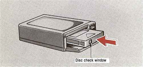 The player will skip any empty disc trays. Disc check window 4. Insert the magazine into the player with the disc check window facing you and close the cover. Be sure the cover is fully closed.