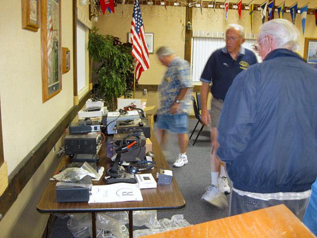 Members look through the goodies before the auction