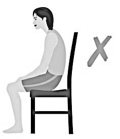 Sit up straight, back not touching the chair, feet flat on the floor, hands and instrument as close to