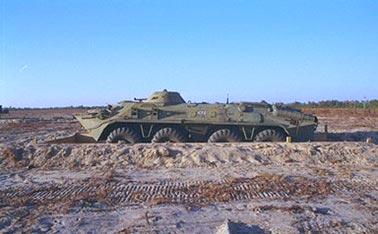 Figure 9. Photograph of a BTR70 in a half-revetment configuration. A half-revetment is designed to obscure objects below the vehicle axle.