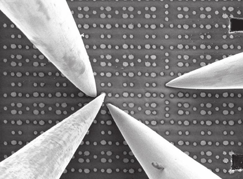 A device called a nanoprobe, located inside the SEM device, has been developed to take measurements of arbitrary transistors in LSIs by manipulating a number of needles with extremely sharp points to