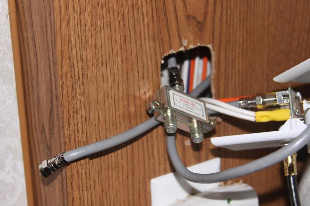 leave the cable running to the bedroom in the same position it has been in. Make a label for the center and top connector and we are done with that. The splitter will be removed.