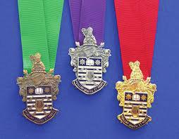 Successful award candidates are entitled to wear a prestigious medal cast in the appropriately coloured metal (bronze, silver or gold) on a distinctive ribbon.