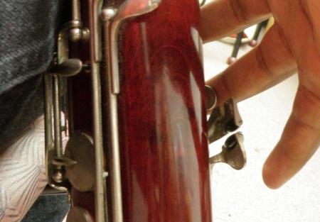 you play and helps avoid gripping the bassoon with the left fingers.