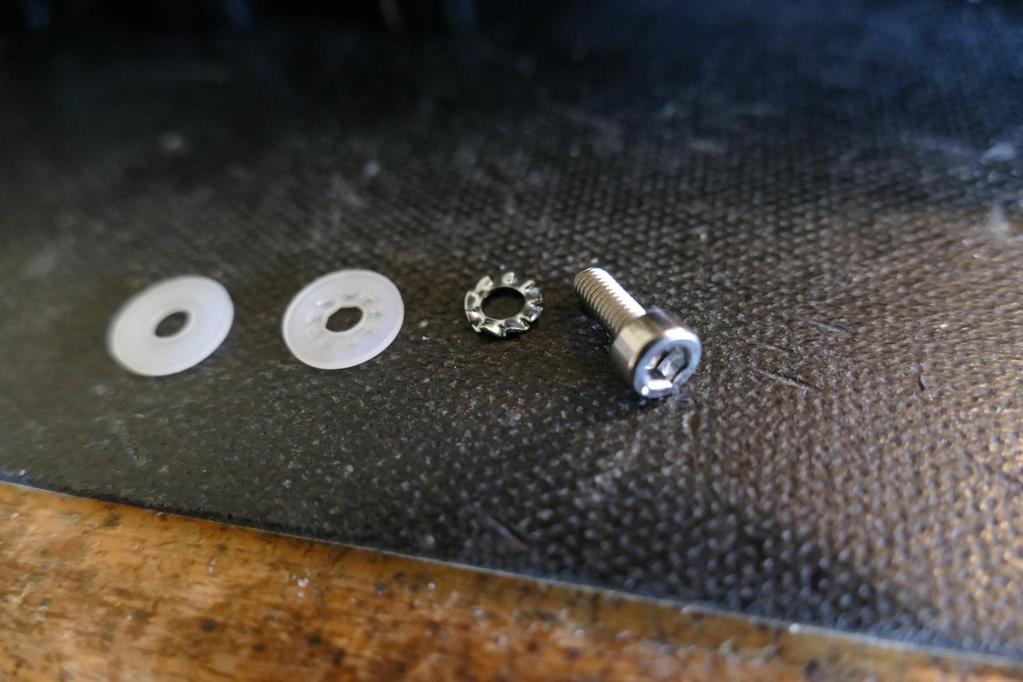 The screw and the washers, that is