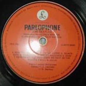 Red Parlophone with Black "Parlophone" and White Logo After mono albums were removed from the general catalog, Venezuelan Parlophone replaced the yellow logo with a black one.