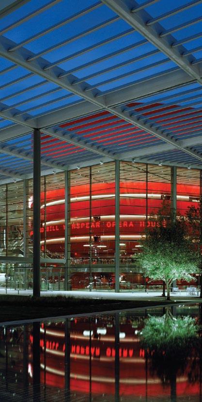 series of spaces that wrap around the rich red glass drum of the performance hall.