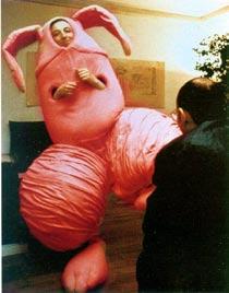 MAURIZIO CATTELAN art into the joke of life ABSURDISM ABOVE Maurizio Cattelan Emanuel Perrotin in a rabbit-penis suit. 2000.
