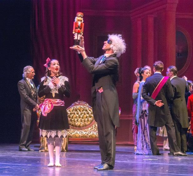 Drosselmeyer has a special gift for Clara: a beautifully painted nutcracker, fashioned in the figure of a toy soldier.