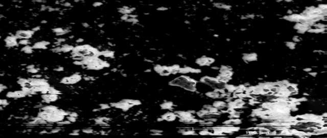 When an SEM image is taken at a higher resolution, the grains of LaPO4 are visible on the surface. Grain size is on the order of 100s of nm, as shown in Fig.