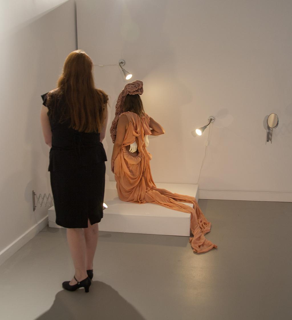 Figure 3. Viewer engaging with a performer from exhibition Peel, Fondle, Ogle.