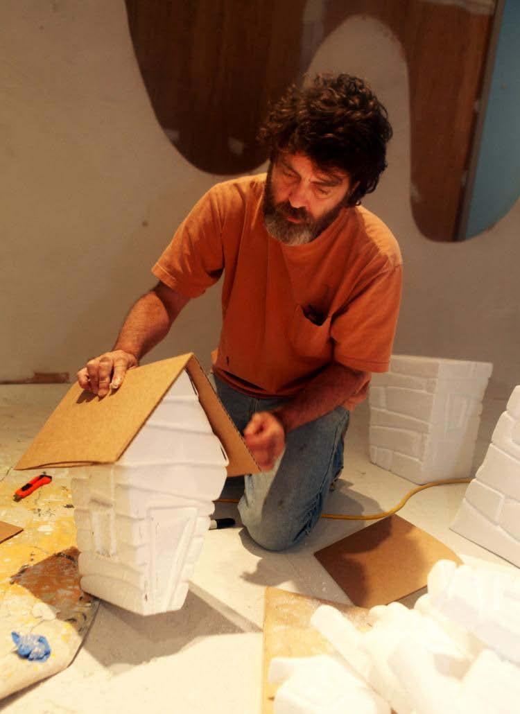 Artist Wayne White assembles a miniature home for Big Lick Boom,