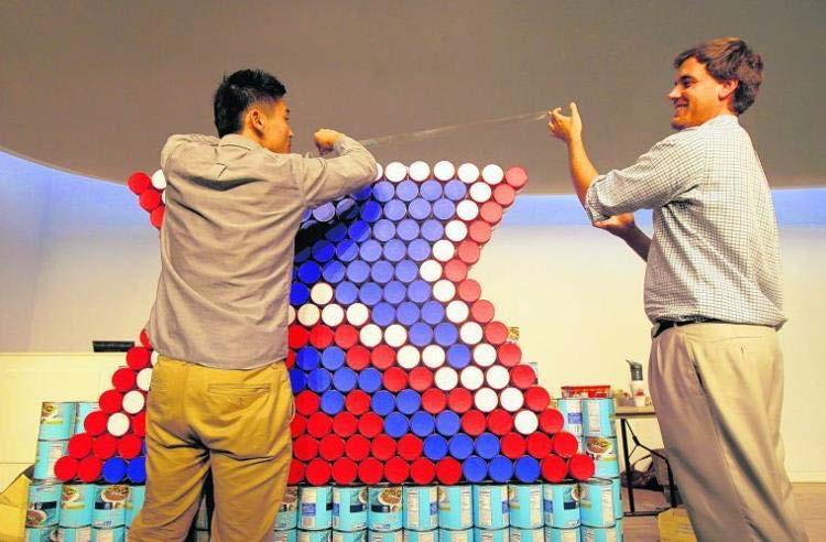 The Roanoke Times File 2013 Hill Studio employees Joe Kim (left) of Blacksburg and Phillip Moore of Roanoke make a Mill Mountain Star out of