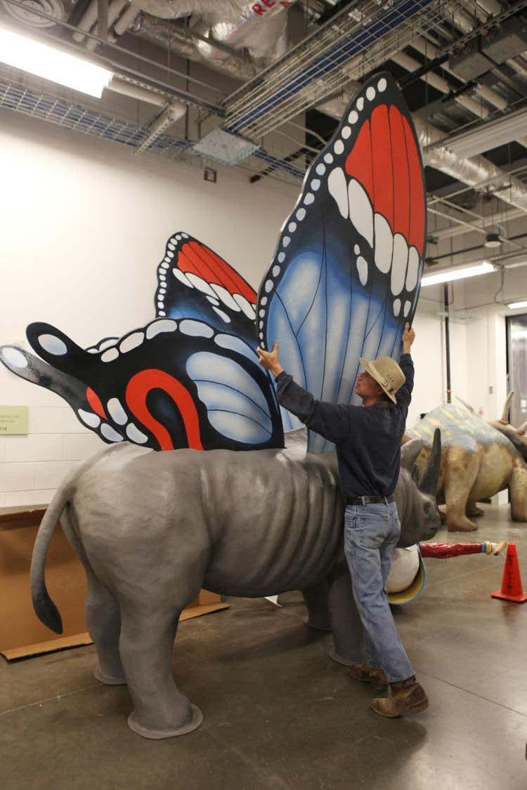 Natural Bridge artist and roadside attraction maker Mark Cline removes the wings of his Butterflynosaros to in order to