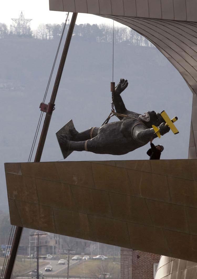 A figure of King Kong is placed on the Taubman balcony as part of