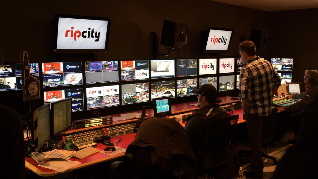 Editors in the Blazers broadcast control room switch between live camera and replay feeds to create their broadcast output feed.
